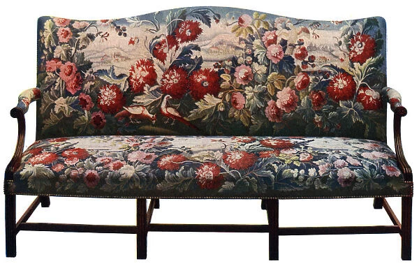 Settee, belonging to a suite of Chippendale furniture covered in an 18th-century tapestry, (c1920)