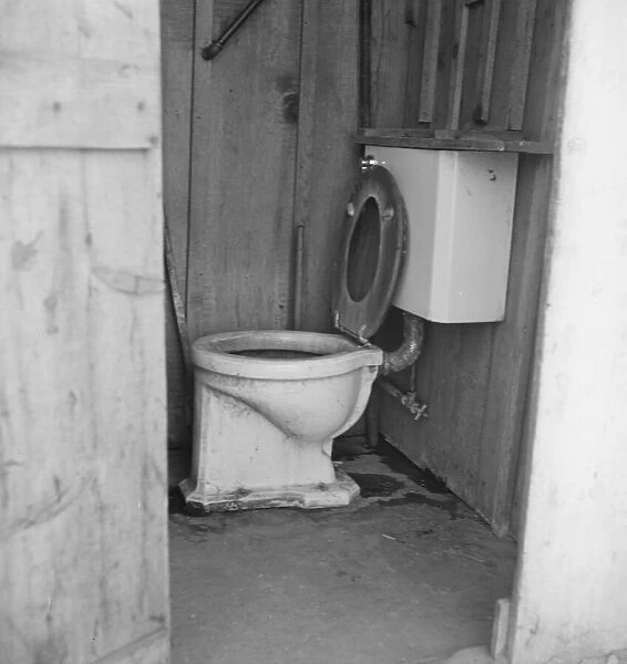 Toilet for ten cabins, men, women... in auto camp... Greenfield, Salinas Valley, CA, 1939. Creator: Dorothea Lange