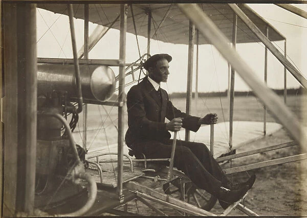 Wilbur Wright in the flyer, 1908. Creator: Anonymous