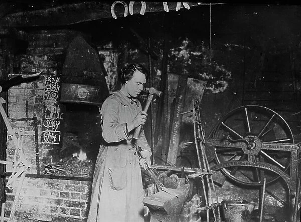 Woman blacksmith, Eng. [i.e. England], between c1915 and 1917. Creator: Bain News Service