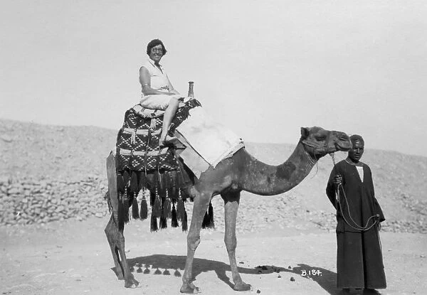 Woman on a camel tour, Egypt, c1920s-c1930s(?)