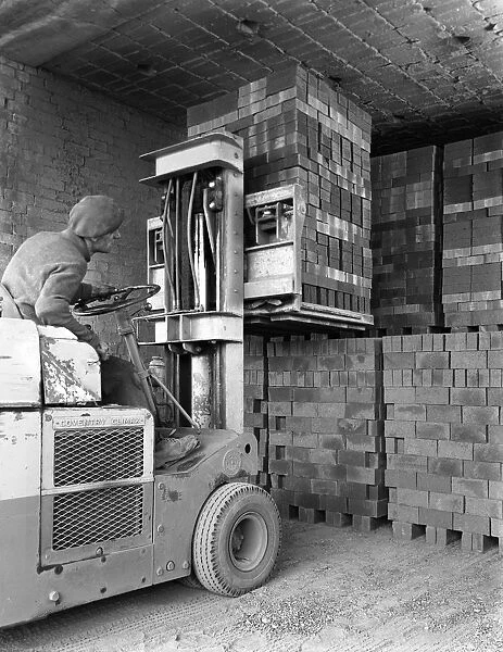 A yardsman stacking pallets of bricks, Whitwick Brickworks, Coalville, Leicestershire, 1963