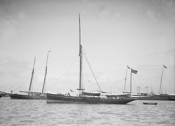 The yawl Beluga at anchor, 1911. Creator: Kirk & Sons of Cowes
