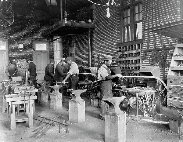 Young men training in blacksmithing at Hampton Institute, Hampton, Virginia, 1899 or 1900. Creator: Frances Benjamin Johnston