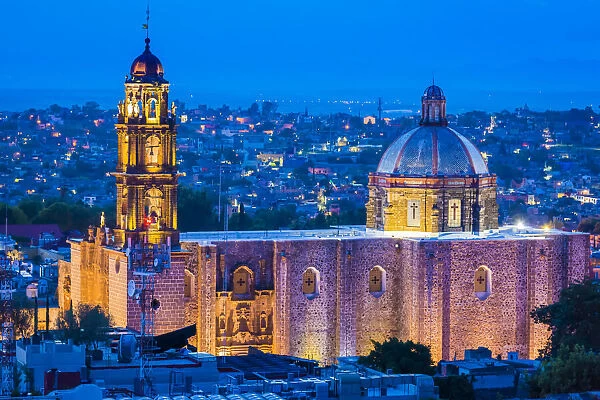 The 18 century Church of San Francisco with the prominent domed roof and bell tower (formerly the Convent of San Antonio) at dusk in San Miguel de Allende, Mexico