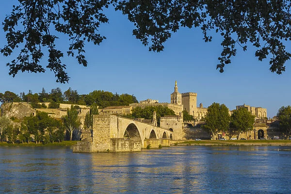 Avignon, Provence-Alpes-Cote d Azur, France. Palais des Papes and Pont St-Benezet. Palace of the Popes and St. Benezet bridge. Rhone River. The historic centre of Avignon is a UNESCO World Heritage Site