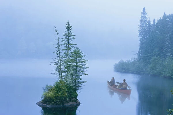 Canoe In The Mist On Jacques-Cartier River At Dawn In Jacques-Cartier National Park; Quebec Canada