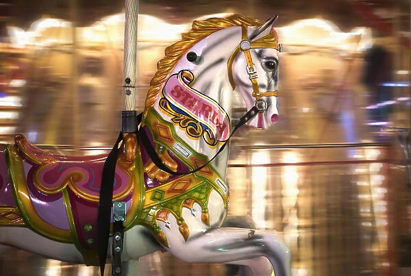 Close Up Of A Painted Horse On A Carousel With Blurred Lights In The Background; Sunderland, Tyne And Wear, England