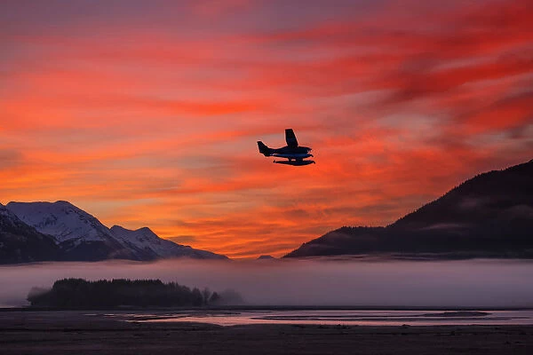 Floatplane Takes Off From Juneau As The Fog Begins To Clear At Sunrise, Southeast Alaska