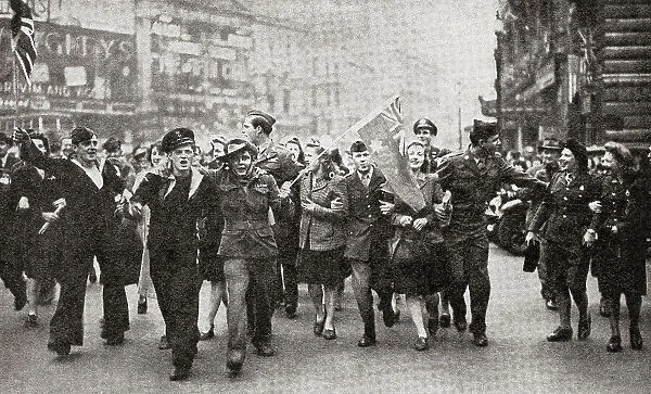 Girls and soldiers in Piccadilly, Lodon, England rejoicing and giving thanks for victory, 9 May 1945 at the end of WWII. From The War in Pictures, Sixth Year.