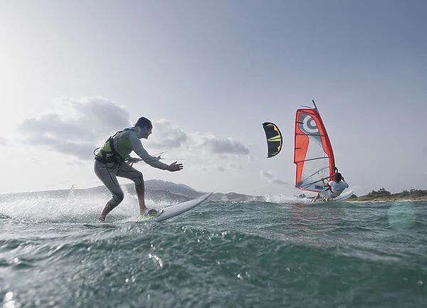 Kitesurfer and windsurfer along the coast; tarifa cadiz andalusia spain