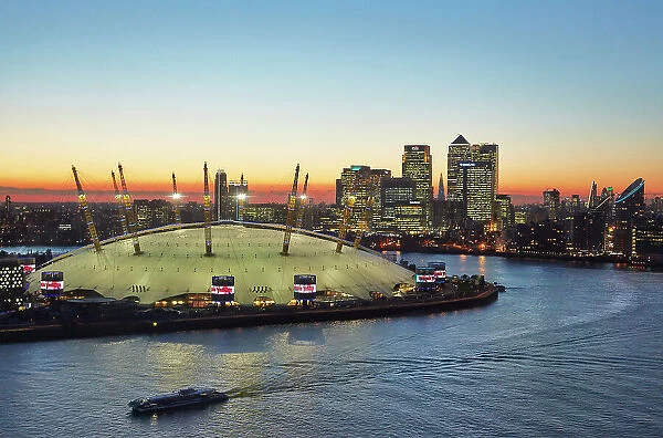 MCH671408. A view from the Emirates Airline of the 02 Arena at sunset with Canary Wharf