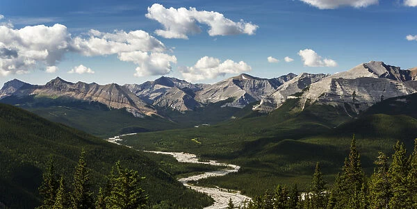 Panorama Of River Valley And Mountain Range With Blue Sky And Clouds; Bragg Creek, Alberta, Canada