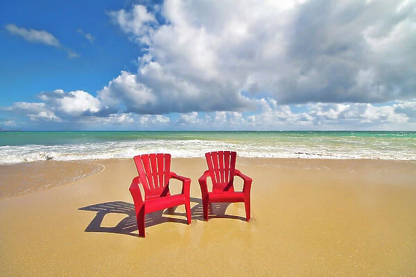 NA. Red Beach chairs beckon. Baldwin Beach. North coast of Maui near Paia town. Hawaii
