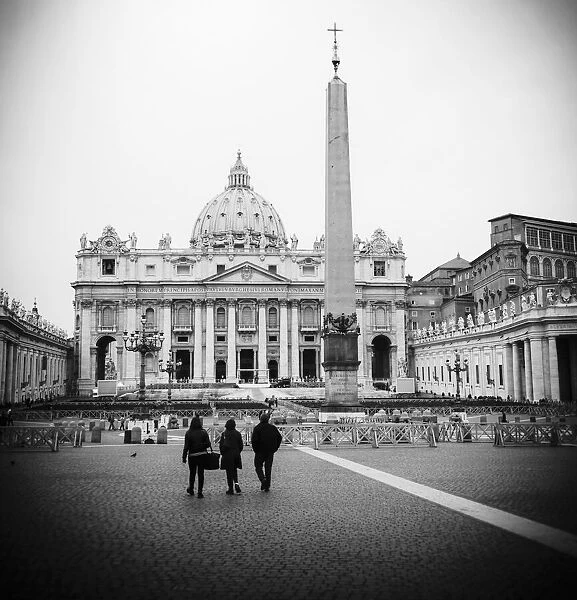 Rome, Italy. St Peters Basilica seen across St Peters Square. The historic centre of Rome is a UNESCO World Heritage Site