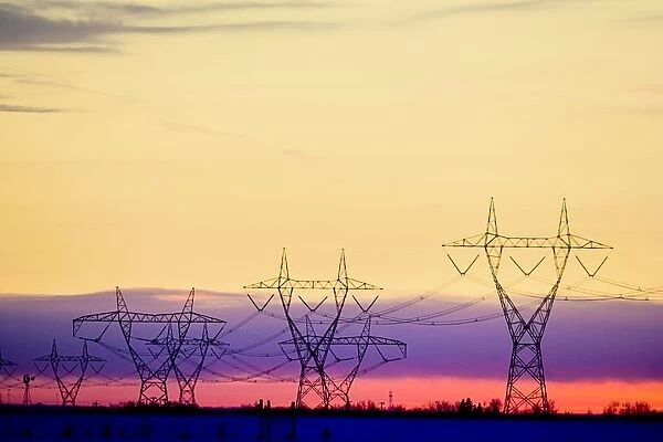 Silhouetted Transmission Towers