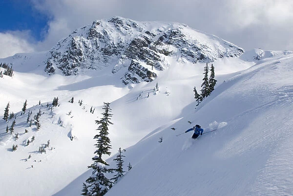Skier Shredding Powder Below Nak Peak, Thar Basin, Cascade Mountains, British Columbia