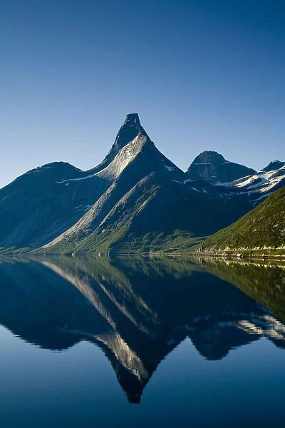 Statin Peak reflected in a still body of water