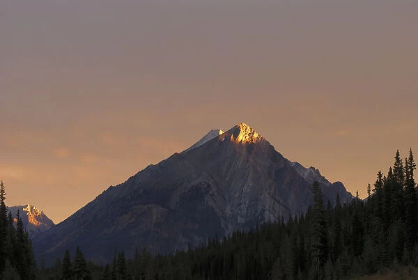Sunrise Lights Up A Mountain Peak; Alberta, Canada