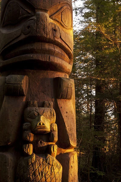 A Totem Catches Some Evening Light At The Sitka National Historic Park; Sitka, Alaska, United States Of America