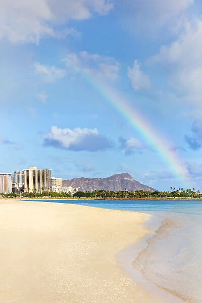 View Of Waikiki Beach And Diamond Head Crater At Ala Moana Beach Park With A Rainbow Overhead; Honolulu, Oahu, Hawaii, United States Of America