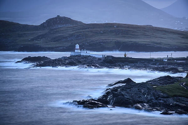 Waves break in predawn hours at Valentia Island Lighthouse on Cromwell Point, Valentia, Ireland