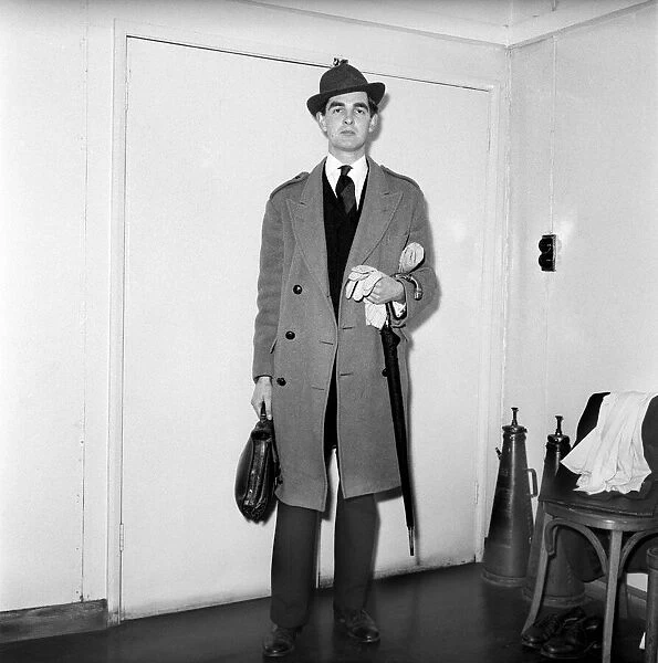 Actor Derek Nimmo dressed as a city gent. March 1957