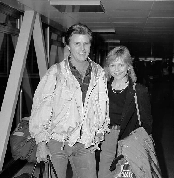 American singer and film actor Rick Nelson accompanied by his girlfriend Helen Blair