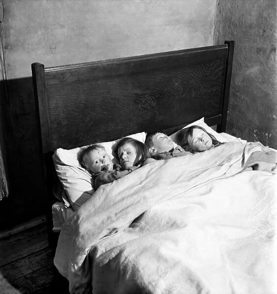 Children of the Duncan family at their home in a Manchester slum