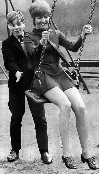 Cilla Black, singer, couldn t resist having a swing as she strolled past a