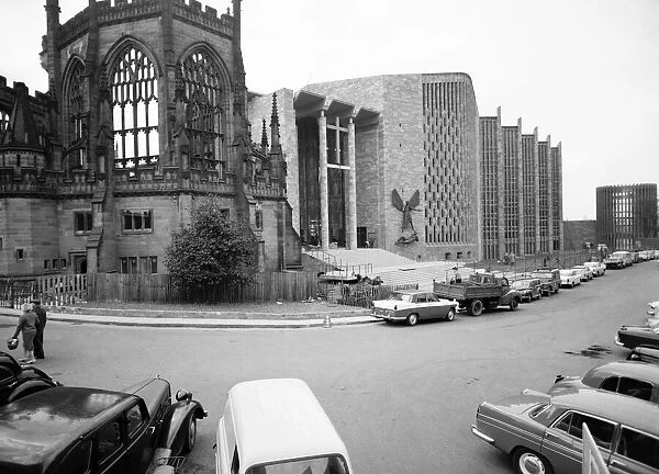 Craftsmen put the finishing touches to the new Coventry Cathedral which stands alongside