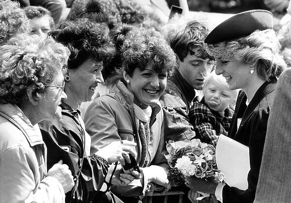 Diana, Princes of Wales chats to the smiling crowd. Huge crowds greeted the Prince