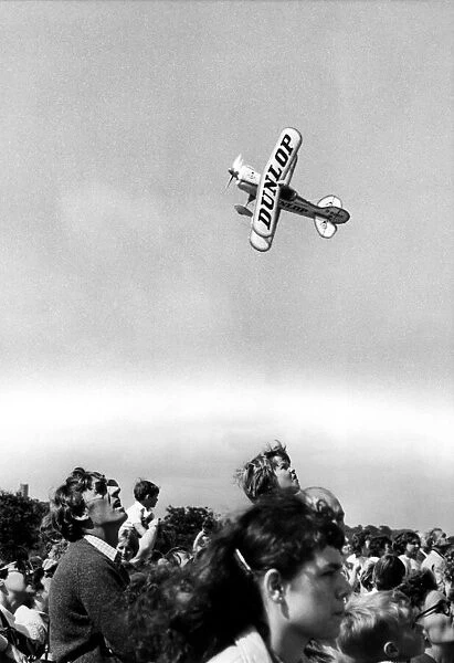 A Dunlop Pitts Special aerobatic aircraft entertains the crowd at the Coquet Show, Amble