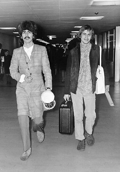 George Harrison and Beatles associate Alexis Mardis (aka Magic Alex) at London Airport