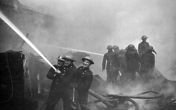 The Great Fire of London. Personnel amidst flame and smoke. 29th December 1940