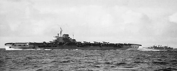 HMS Victorious on her way back from Norwegian waters with attendant cruiser