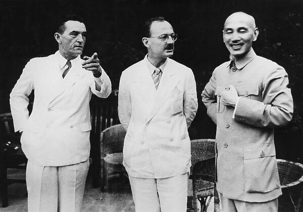 Two important Americans in China talk with Chiang at a Chung Ping tea Colonel Claire L