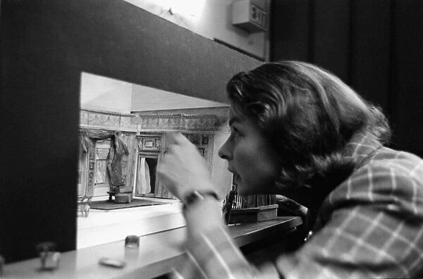 Ingrid Bergman is fascinated with the replicia of the stage set for the play she will be