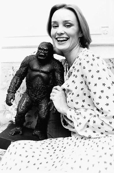 Jessica Lange Actress holding a model of King Kong after arriving in London Dbase MSI