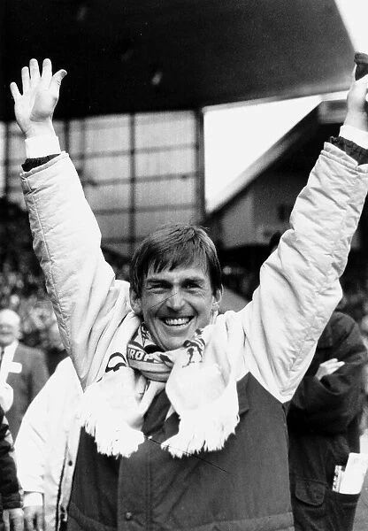 Kenny Dalglish manager Liverpool FC with arms in the air raised scarf around neck