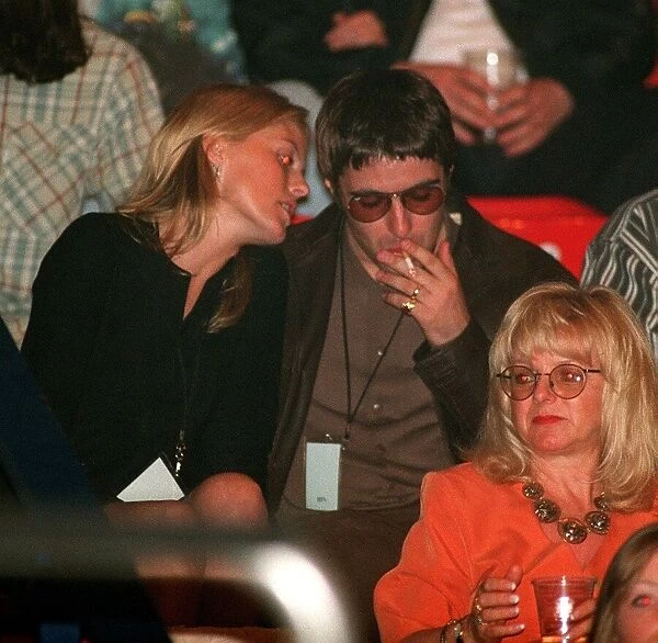 Liam Gallagher of Oasis and his wife model Patsy Kensit watch The Who concert in Wembley
