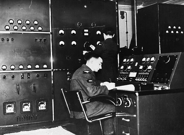 Mechanic at the control desk of a transmitting station. 18th June 1941