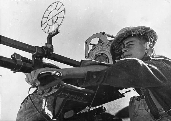 R. A. F. manning an anti-aircraft gun. Pictured in Great Britain, possibly England