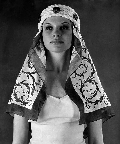 Reveille fashions 1965: Model wearing Desert Sheikh headwear. August 1965 P009448
