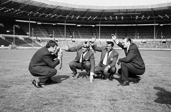 Salford Red Devils rugby league team members inspect the pitch at Wembley Stadium ahead