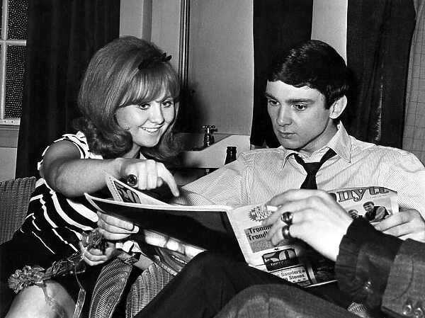 Singing stars Lulu and Gene Pitney relax during an interval between shows at the Capitol