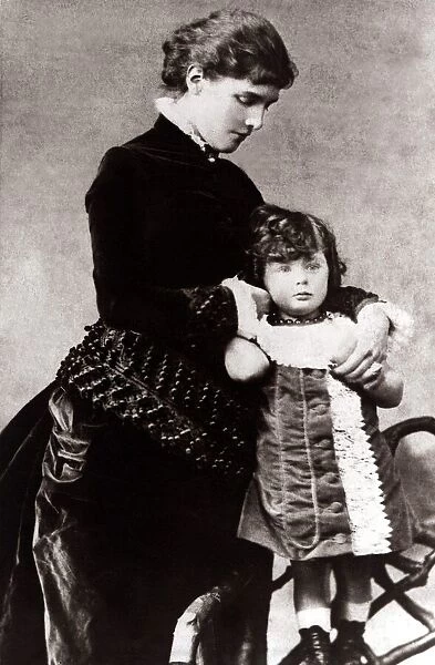 Sir Winston Churchill as a child - circa 1878, standing on a chair, wearing a dress