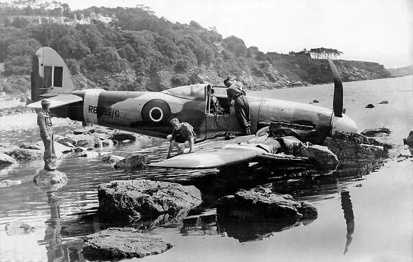 A Typhoon makes a pancake landing, on the edge of a rock strewn shore near Torquay in