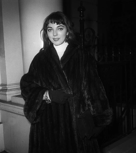 A young Joan Collins en route to the US embassy in London to apply for a visa
