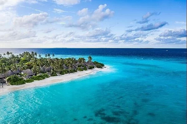 Aerial photo of beautiful paradise tropical beach on island. Summer travel vacation concept. Aerial drone view of beach palm trees with turquoise sea